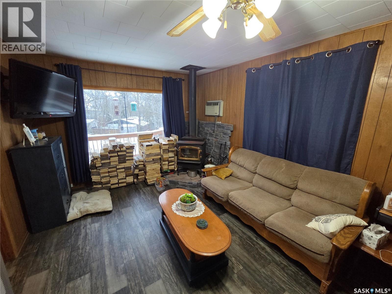 697 8Th Street, White Bear Ir 70, SK - Indoor Photo Showing Living Room With Fireplace