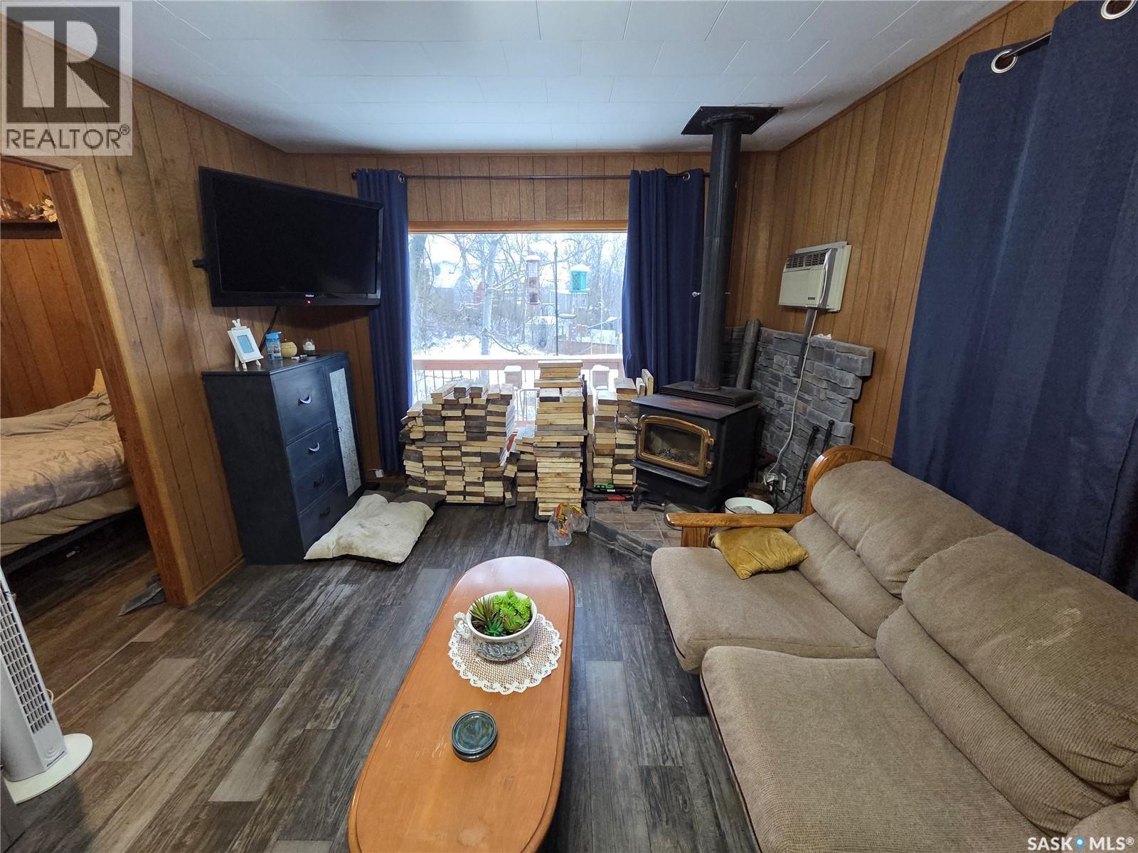 697 8Th Street, White Bear Ir 70, SK - Indoor Photo Showing Living Room With Fireplace