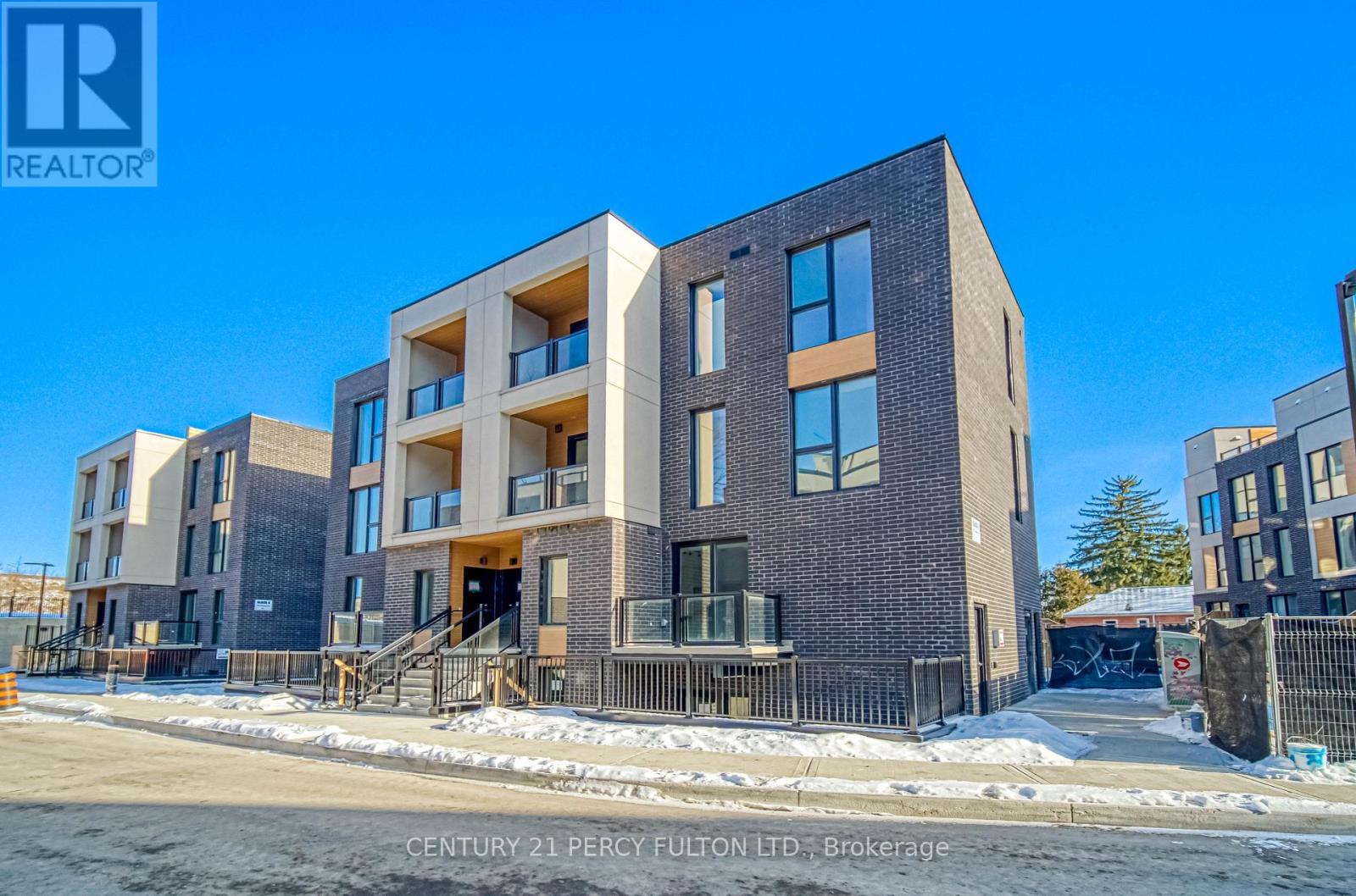 8 - 178 Clonmore Drive, Toronto, ON - Outdoor With Balcony With Facade