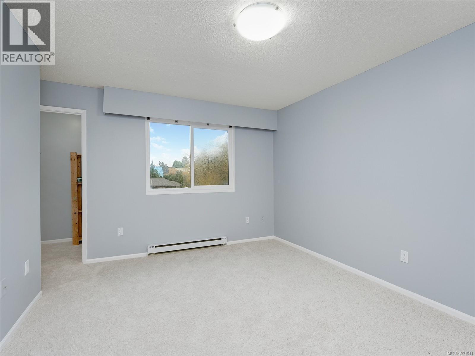 Primary Bedroom - 302 859 Carrie St, Esquimalt, BC - Indoor Photo Showing Other Room