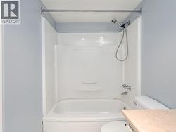 Bathroom with vanity and shower / bathtub combination -