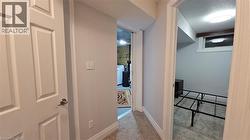 Hall featuring carpet floors and a textured ceiling -