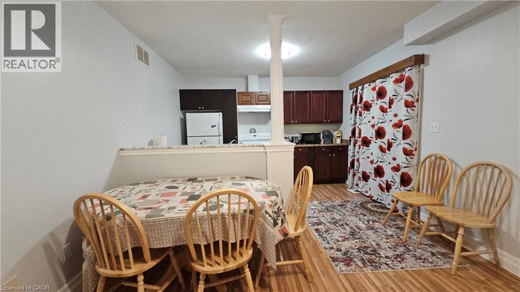Dining space featuring light wood-style flooring and baseboards - 10 Doll Court Unit# Lower, Kitchener, ON - Indoor Photo Showing Dining Room
