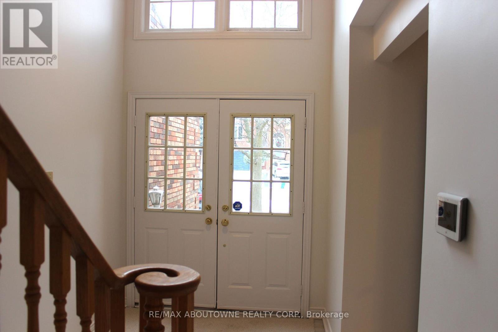 Cathedral ceiling entrance - 2033 Lumberman Lane, Oakville, ON - Indoor Photo Showing Other Room