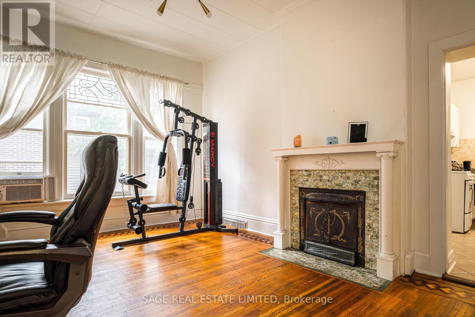 95-97 Fairholt Road S, Hamilton, ON - Indoor Photo Showing Gym Room With Fireplace