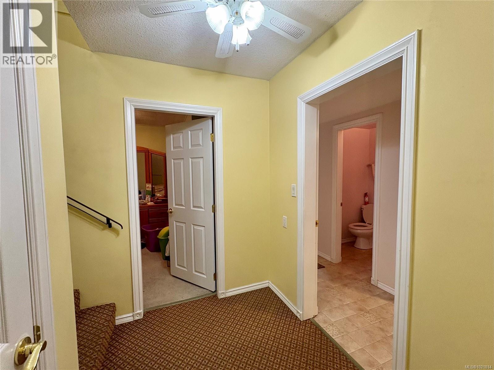 Corridor featuring a textured ceiling and light colored carpet - 2738 14Th Ave, Port Alberni, BC - Indoor Photo Showing Other Room