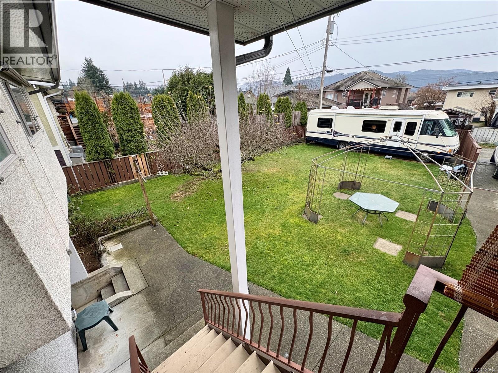 View of fenced backyard - 2738 14Th Ave, Port Alberni, BC - Outdoor With Exterior
