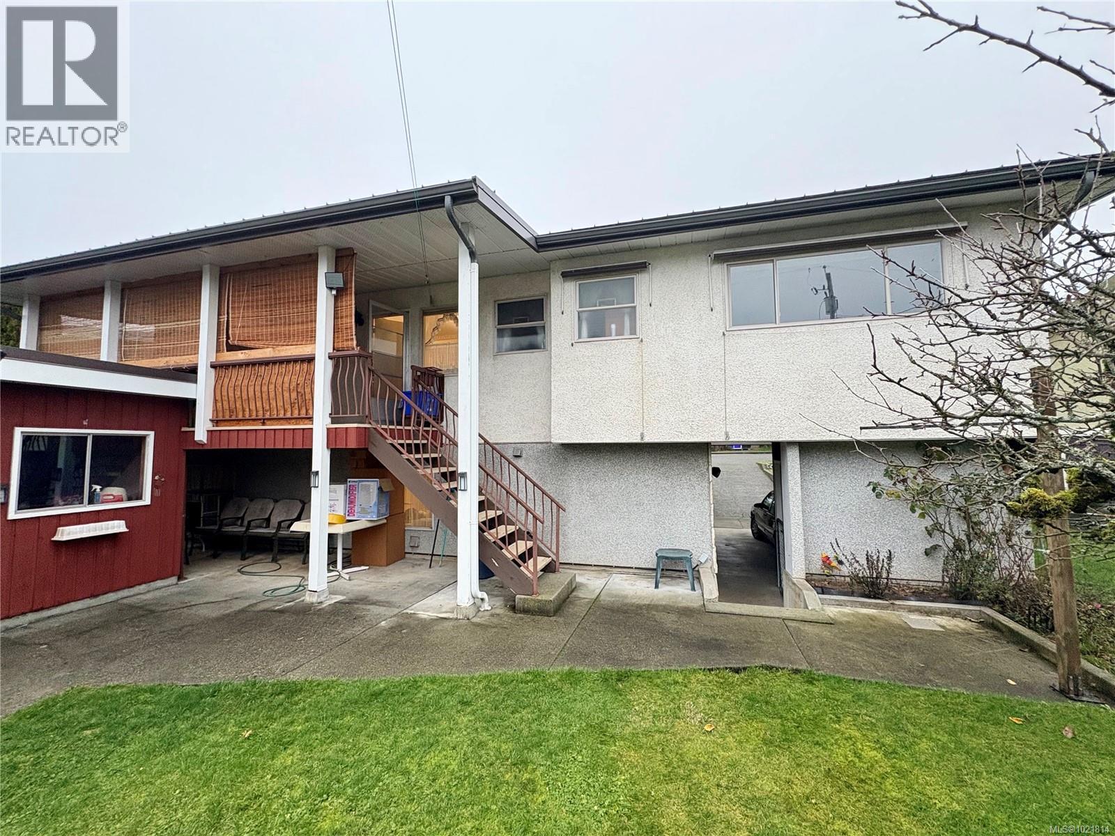 Back of house with stairs, a patio, a yard, and stucco siding - 2738 14Th Ave, Port Alberni, BC - Outdoor With Deck Patio Veranda