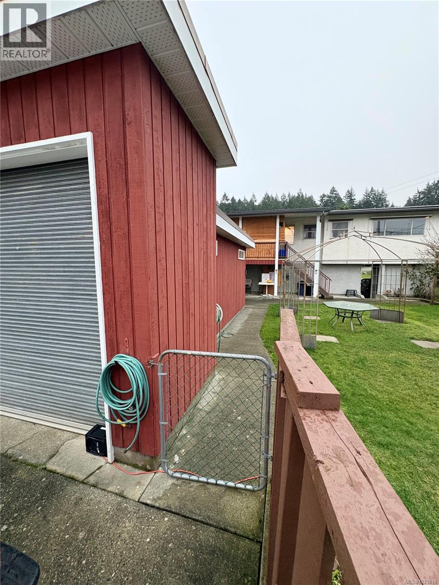 View of property exterior with board and batten siding - 2738 14Th Ave, Port Alberni, BC - Outdoor With Exterior