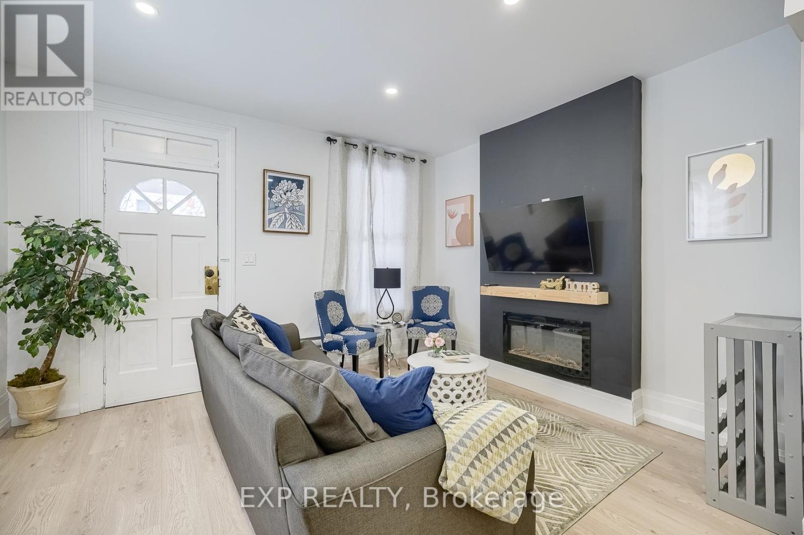 Living Room - 8 Elizabeth Street, St. Catharines, ON - Indoor Photo Showing Living Room With Fireplace