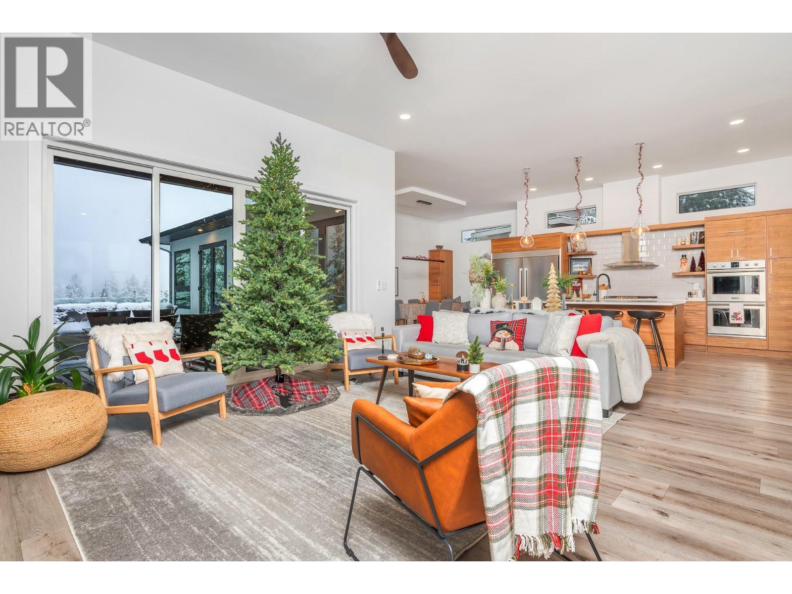 Doors to the deck - 9196 Tronson Road Unit# 29, Vernon, BC - Indoor Photo Showing Living Room