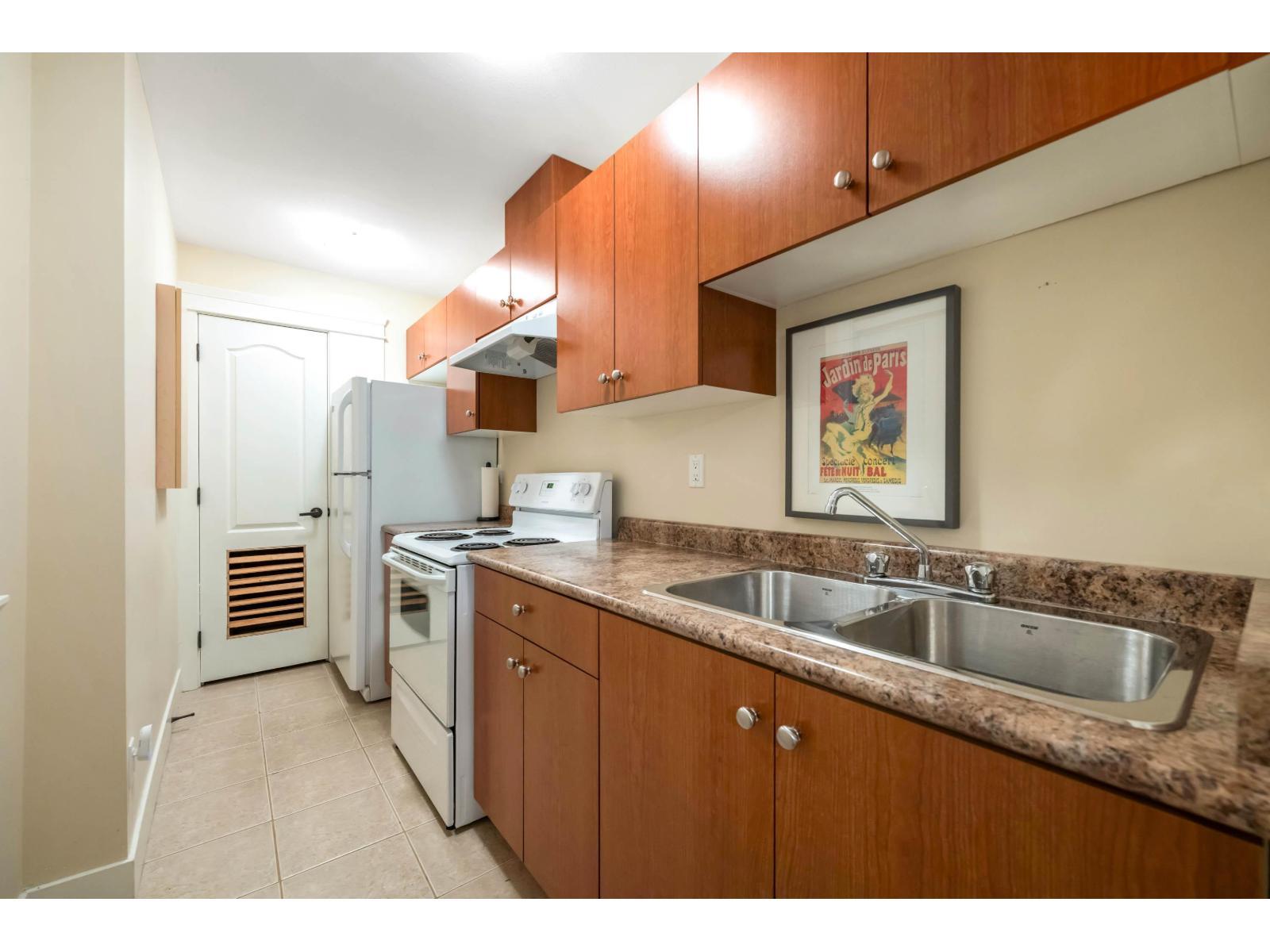 7137 196 Street, Surrey, BC - Indoor Photo Showing Kitchen With Double Sink