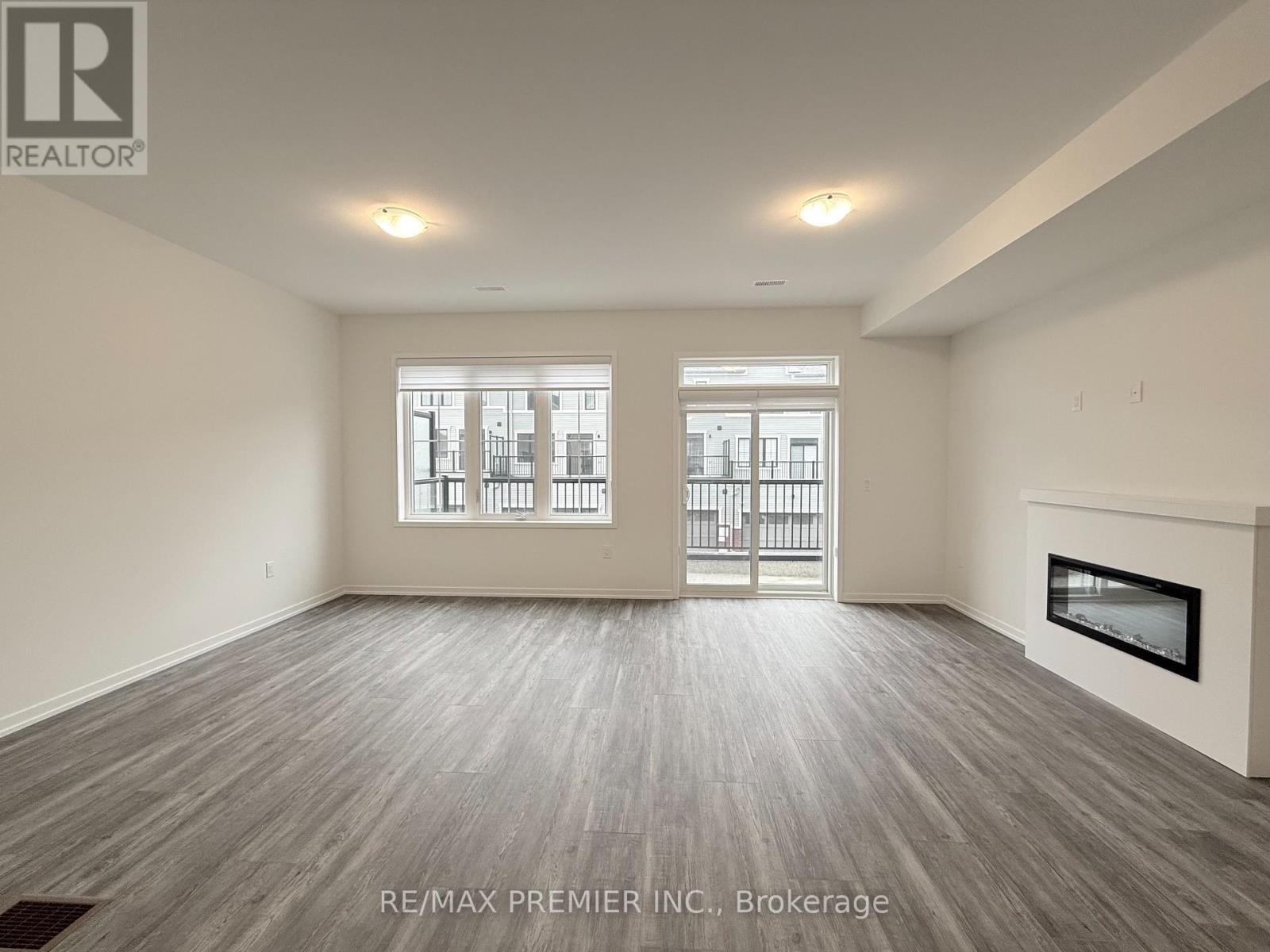 12 Kingbird Common, Cambridge, ON - Indoor Photo Showing Other Room With Fireplace
