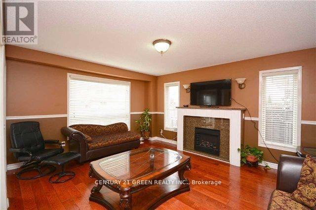 Main - 1046 Freeman Trail, Milton, ON - Indoor Photo Showing Living Room With Fireplace