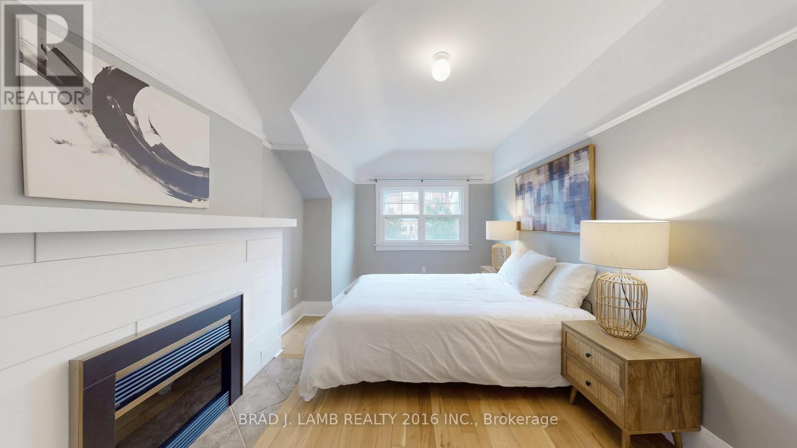 107 Woodbine Avenue, Toronto, ON - Indoor Photo Showing Bedroom With Fireplace