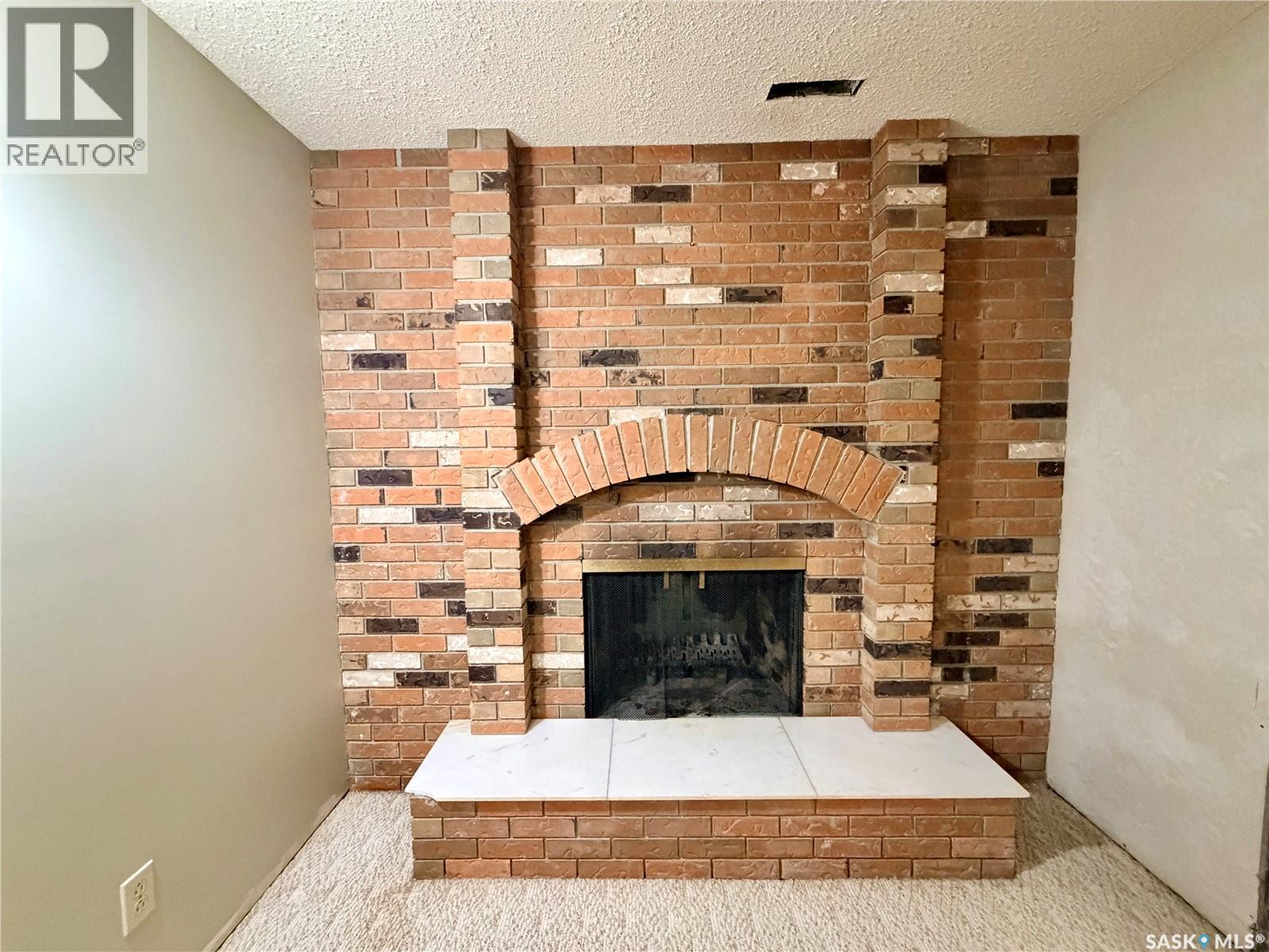 20 4Th Avenue E, Neilburg, SK - Indoor Photo Showing Living Room With Fireplace