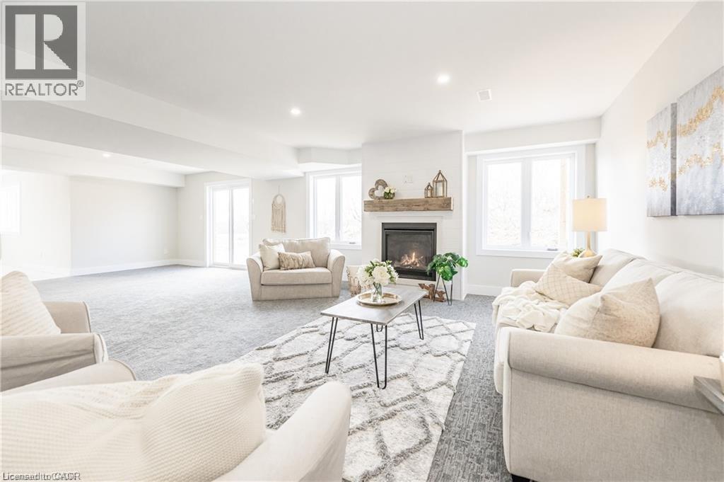 1050 Walton Avenue, North Perth, ON - Indoor Photo Showing Living Room With Fireplace