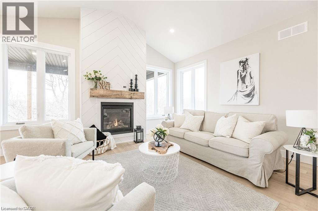 1050 Walton Avenue, North Perth, ON - Indoor Photo Showing Living Room With Fireplace