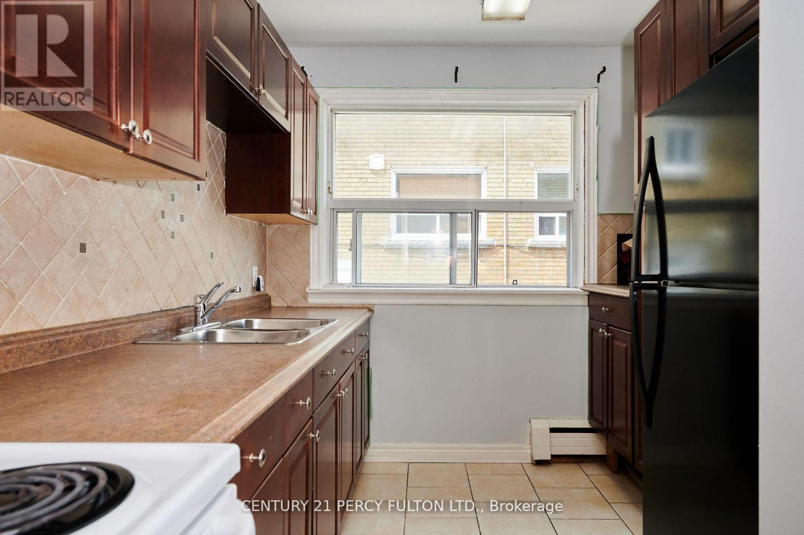 2961 Lawrence Avenue E, Toronto, ON - Indoor Photo Showing Kitchen With Double Sink