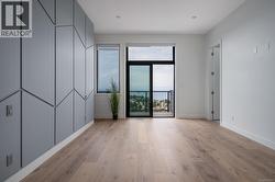 Empty room with light wood-style floors and baseboards -