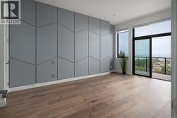 Empty room with light wood-style floors and baseboards -