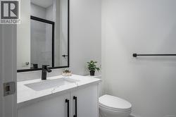 Full bath featuring vanity and a shower stall -