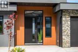 Doorway to property with stone siding -