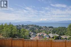 Aerial view of residential area with a water and mountain view -