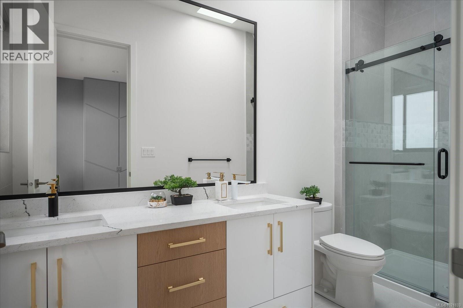 Full bathroom featuring double vanity and a stall shower - 4680 Ambience Dr, Nanaimo, BC - Indoor Photo Showing Bathroom