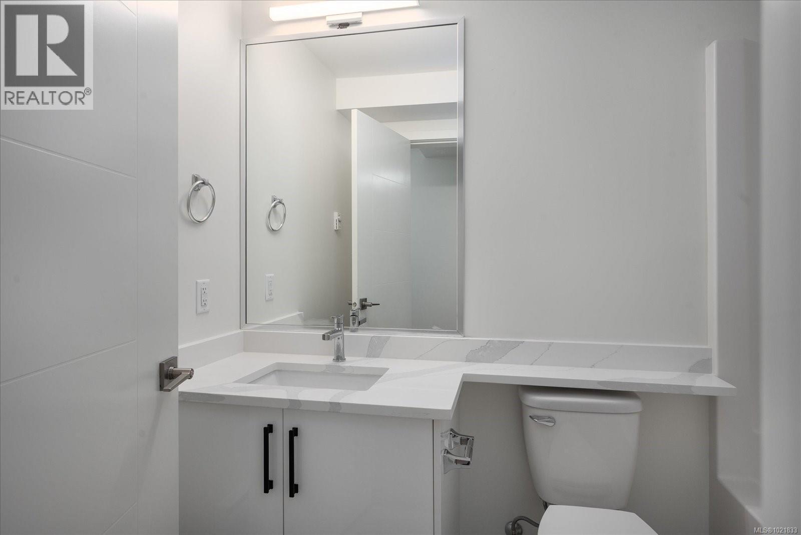 Half bathroom featuring vanity and toilet - 4680 Ambience Dr, Nanaimo, BC - Indoor Photo Showing Bathroom