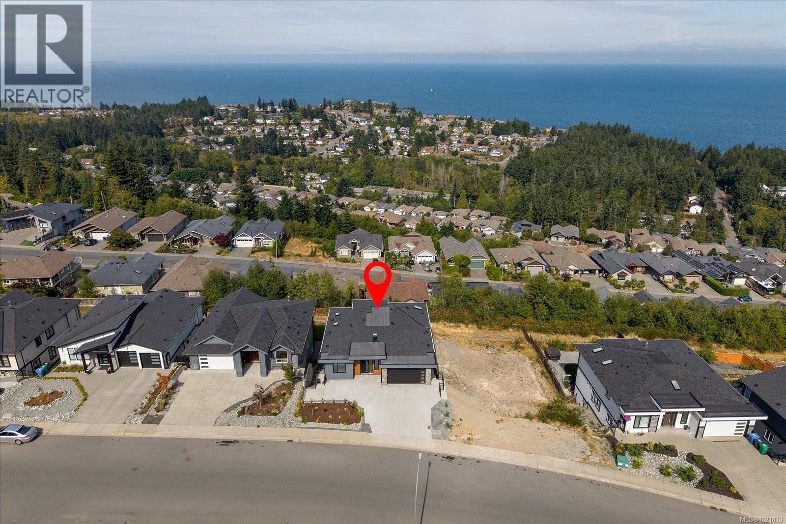 Aerial overview of property's location featuring nearby suburban area and a nearby body of water - 4680 Ambience Dr, Nanaimo, BC - Outdoor With Body Of Water With View