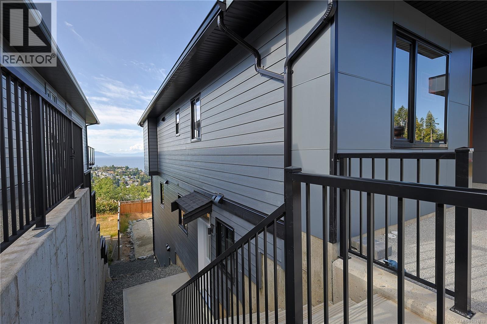 View of side of home - 4680 Ambience Dr, Nanaimo, BC - Outdoor With Exterior