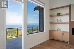 Unfurnished dining area featuring light wood-style floors and a water view -