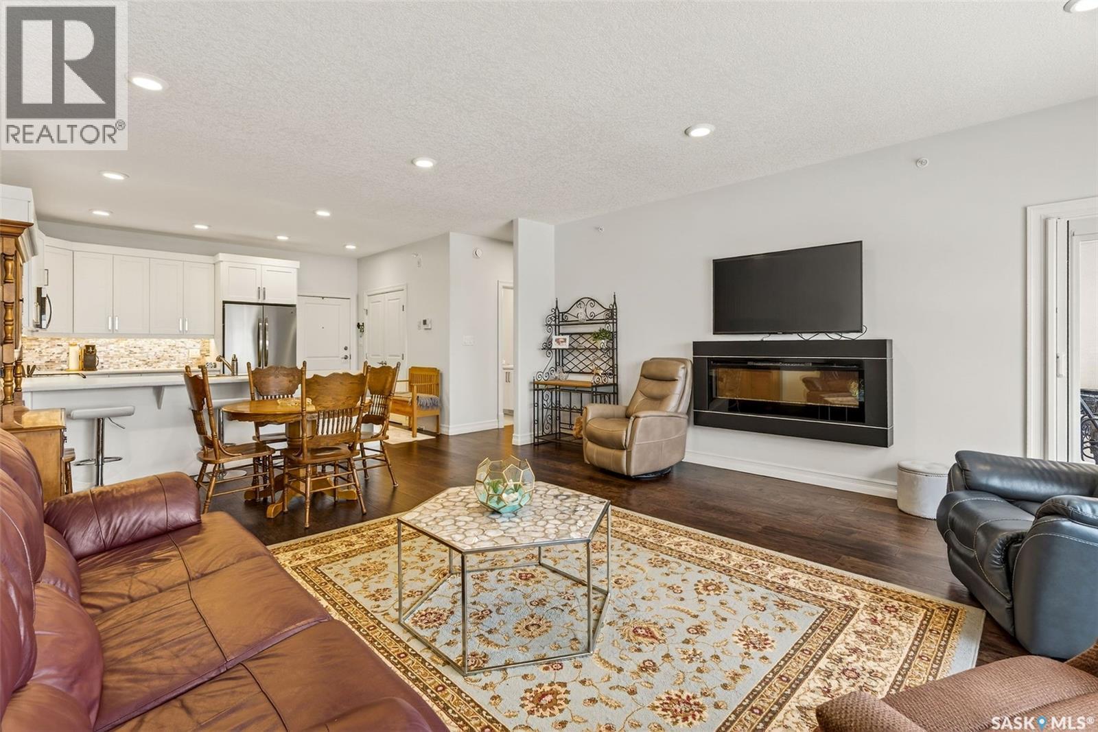 304 2800 Lakeview Drive, Prince Albert, SK - Indoor Photo Showing Living Room With Fireplace