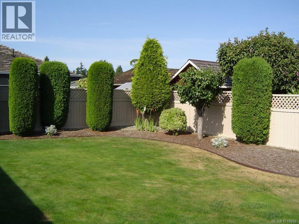Fenced Backyard in the summer - 751 Anson Pl, Qualicum Beach, BC - Outdoor