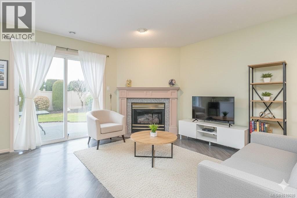 VIRTUALLY STAGED Family Room - 751 Anson Pl, Qualicum Beach, BC - Indoor Photo Showing Living Room With Fireplace