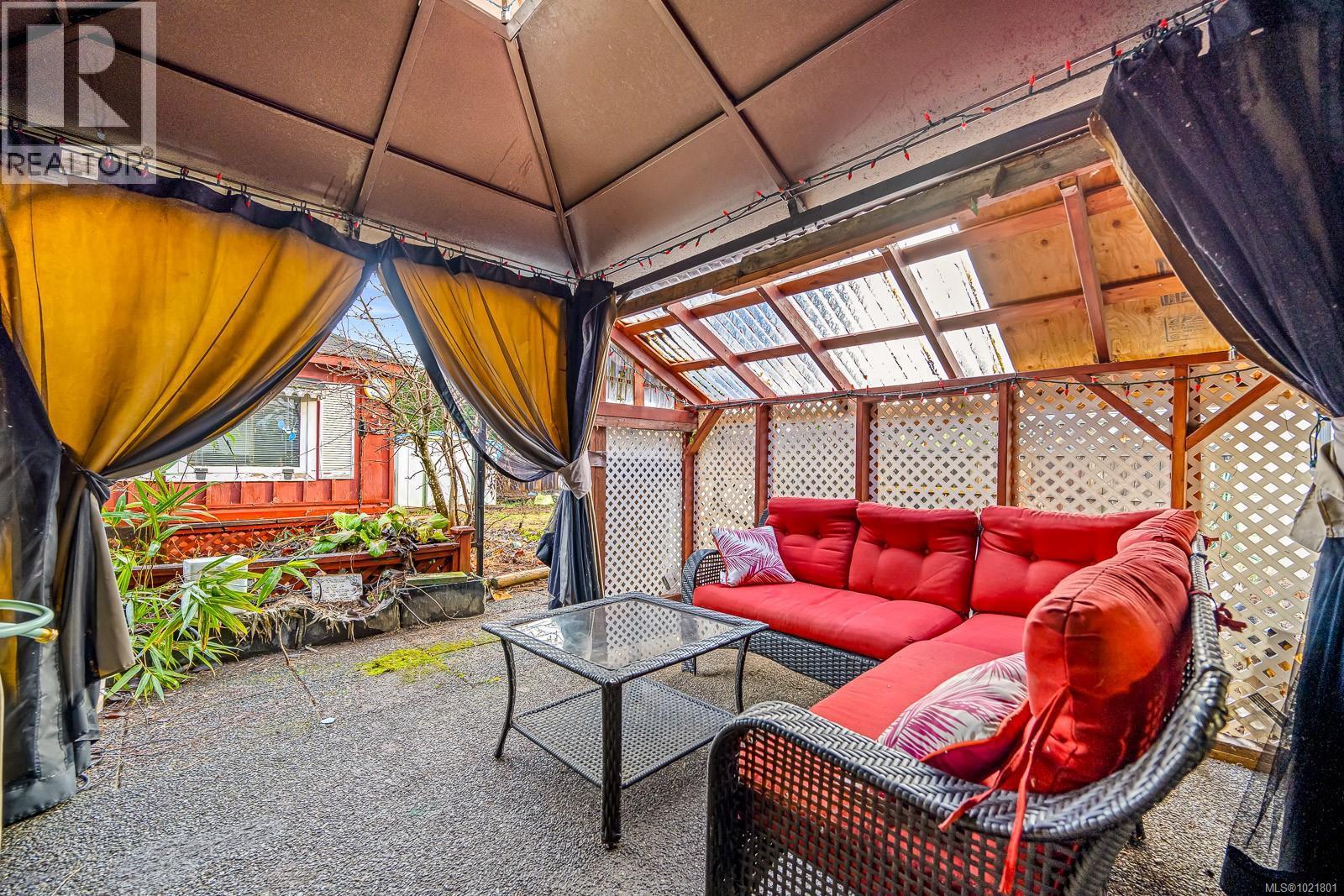 2316B Willemar Ave, Courtenay, BC - Indoor Photo Showing Other Room With Fireplace