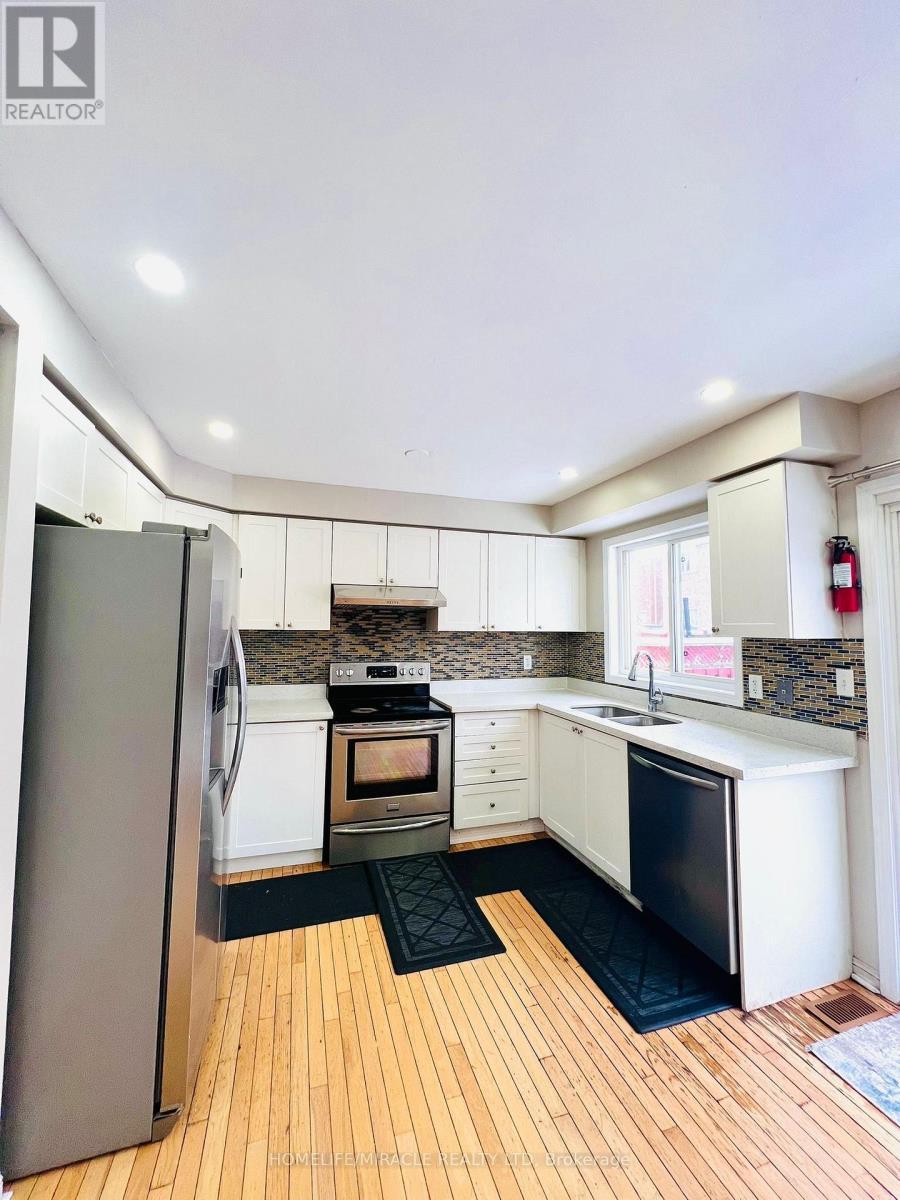 16 Marshmarigold Drive, Brampton, ON - Indoor Photo Showing Kitchen With Double Sink