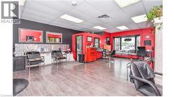 Misc room with a drop ceiling and a desk -