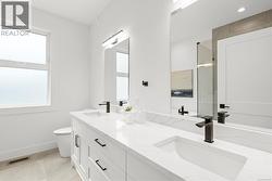 Powder room beside front bedroom and living room - great for guests. -