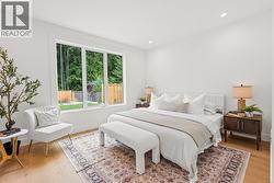 Primary bedroom tucked away at the back of the home. -