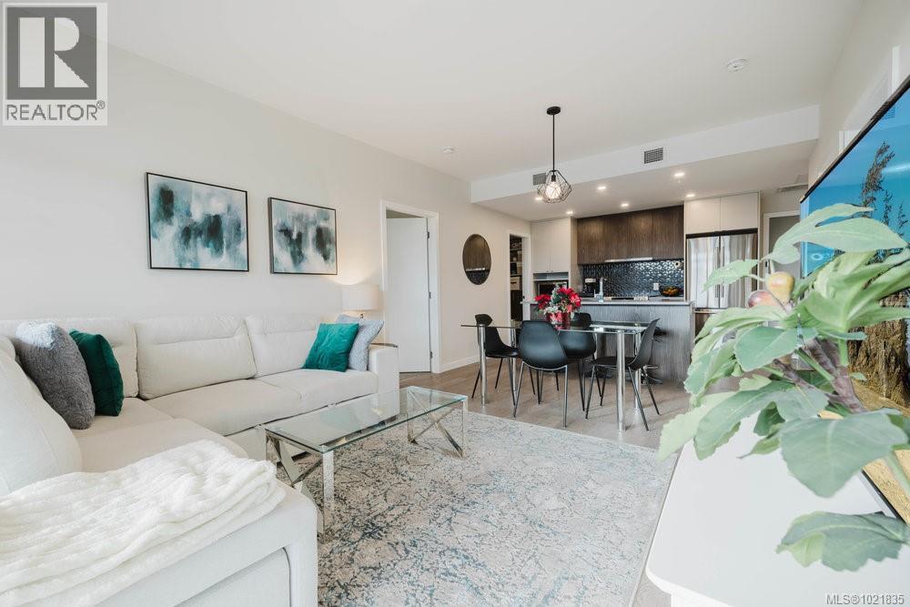 Living area with recessed lighting - 210 881 Short St, Saanich, BC - Indoor Photo Showing Living Room