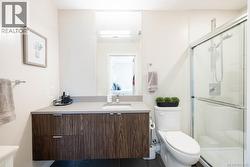 Full bath featuring vanity, connected bathroom, and a stall shower -