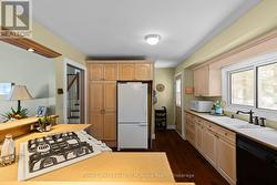 Rear main floor entrance leads to lower level. -