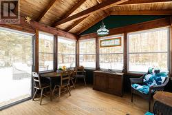 Walkout from Muskoka Room to deck area and garden. -