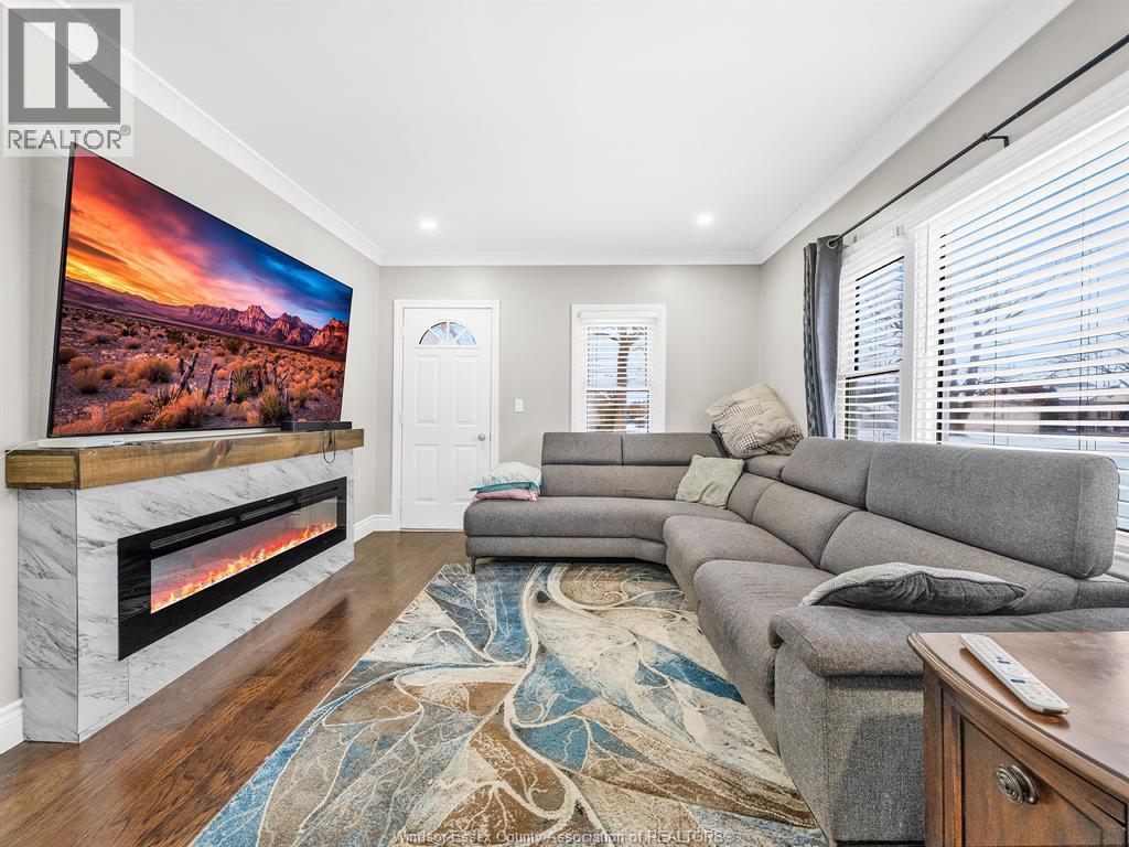 3691 Riberdy Road, Windsor, ON - Indoor Photo Showing Living Room With Fireplace
