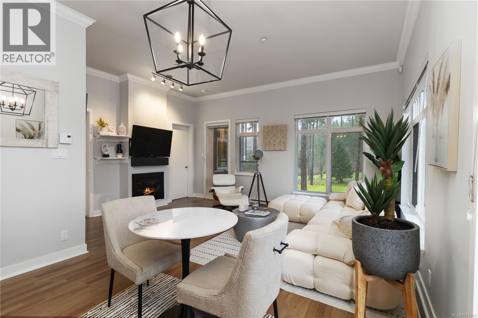 420 1395 Bear Mountain Pkwy, Langford, BC - Indoor Photo Showing Living Room With Fireplace