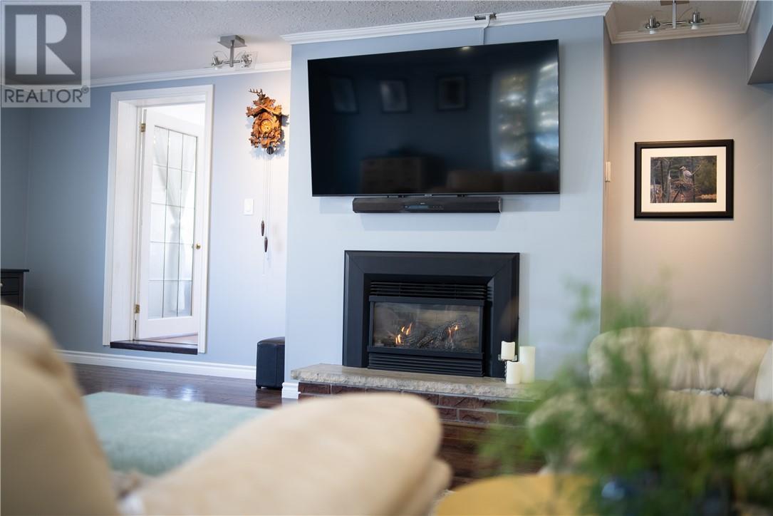 54 Jean Street, Alban, ON - Indoor Photo Showing Living Room With Fireplace