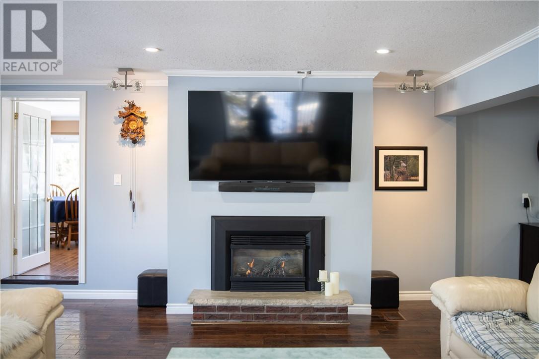 54 Jean Street, Alban, ON - Indoor Photo Showing Living Room With Fireplace