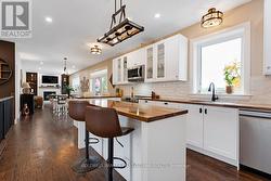 Kitchen culinary delight with textured backsplash -